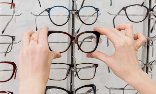 close-up-woman-hand-removing-eyeglasses-from-display-1